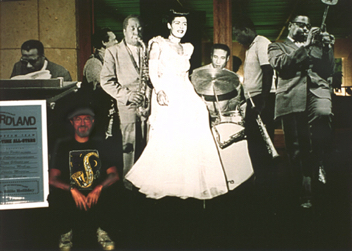 Life-sized all-star cut-out jazz septet jams onstage as &ldquo;Jazz&rdquo; exhibit designer/co-curator sits in, UT Austin, 2004.